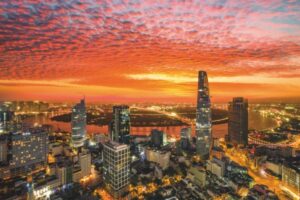 Aerial view of beautiful sunrise over high building and business centre of Ho Chi Minh City - The biggest city in Vietnam