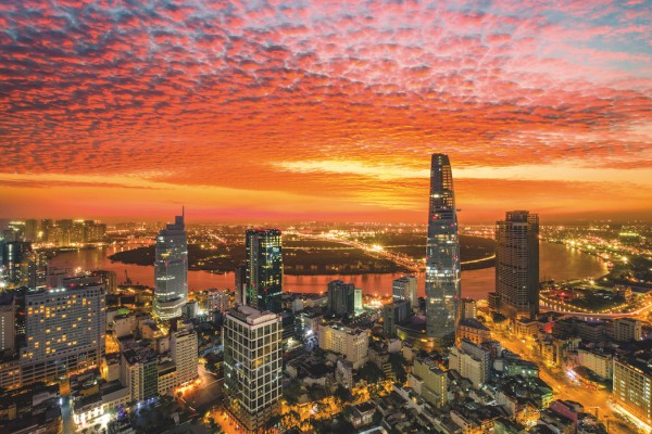 Aerial view of beautiful sunrise over high building and business centre of Ho Chi Minh City - The biggest city in Vietnam