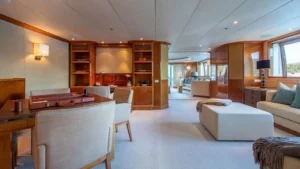 Main interior lounge aboard superyacht Alamshar showcasing elegant woodwork and relaxed seating areas