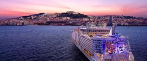 Allure of the Seas cruise ship sailing at sunset during 15 years of service with Royal Caribbean