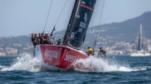 Italian skipper Ambrogio Beccaria celebrates winning Leg 4 of The Ocean Race Europe 2025 in Genoa, Italy, aboard Allagrande Mapei IMOCA 60 yacht at dawn on December 5, 2025