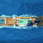 Aerial top-down view of a Norwegian Cruise Line ship showing deck layout and onboard attractions