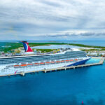 Carnival cruise ship sailing under stormy skies as winter weather impacts cruise schedules