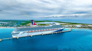 Carnival cruise ship sailing under stormy skies as winter weather impacts cruise schedules