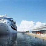 Cruise ship docked at a newly developed cruise terminal showcasing modern port infrastructure and passenger facilities
