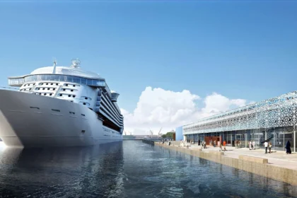 Cruise ship docked at a newly developed cruise terminal showcasing modern port infrastructure and passenger facilities
