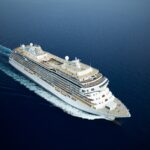 Regent Seven Seas Cruises luxury ship sailing at sea during free suite upgrade promotion