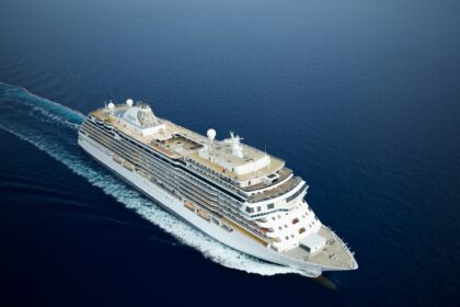 Regent Seven Seas Cruises luxury ship sailing at sea during free suite upgrade promotion