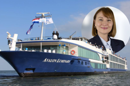 Michaela Julian, newly appointed EVP of Operations at River Advice, pictured alongside the Avalon Luminary river cruise ship.