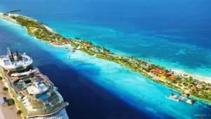 Aerial view of Royal Caribbean’s new Beach Club at Paradise Island in Nassau, showing turquoise waters, landscaped beachfront areas, and a cruise ship docked nearby.
