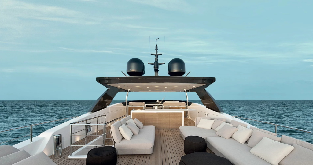 Upper deck lounge area aboard the Sanlorenzo SL106 motor yacht Piacere III, featuring modern outdoor seating and open-sea views