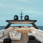 Upper deck lounge area aboard the Sanlorenzo SL106 motor yacht Piacere III, featuring modern outdoor seating and open-sea views
