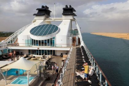Seabourn Sojourn sailing during its 2026 world cruise, featuring open deck spaces and panoramic ocean views during a long-haul global voyage.
