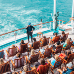 Students participating in an outdoor class aboard the Semester at Sea ship while sailing at sea during a global academic voyage.