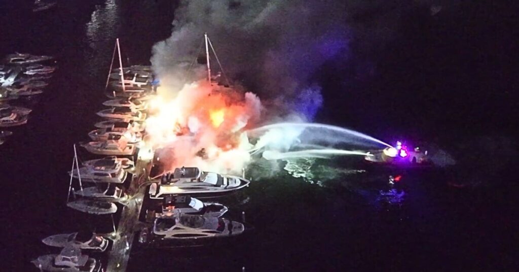 Aerial view of fire tearing through yachts at Sydney’s Spit Marina at night