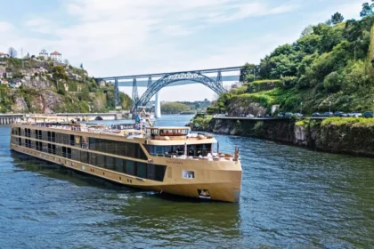 AmaWaterways river cruise ship sailing through a scenic European river during sunset