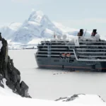 Seabourn Venture expedition ship navigating Antarctic ice near 70 degrees south