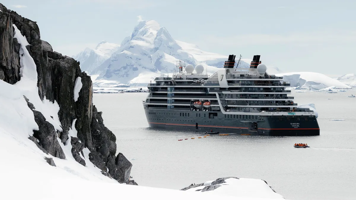 Seabourn Venture expedition ship navigating Antarctic ice near 70 degrees south